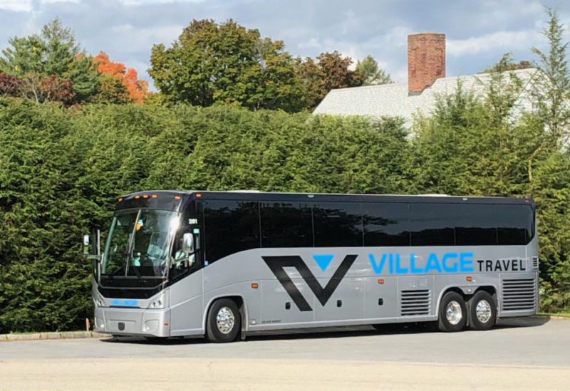 Executive Recliner Motorcoach Village Travel Charter Bus Exterior Executive Recliner Motorcoach Village Travel Charter Bus Exterior
