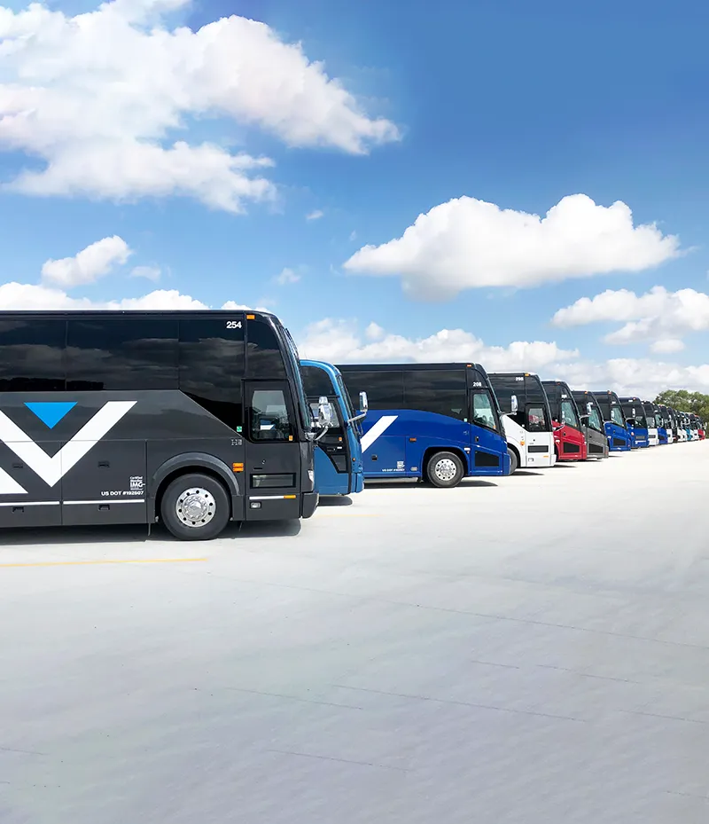 Village Travel Coaches Lined Up Waiting For Large Groups